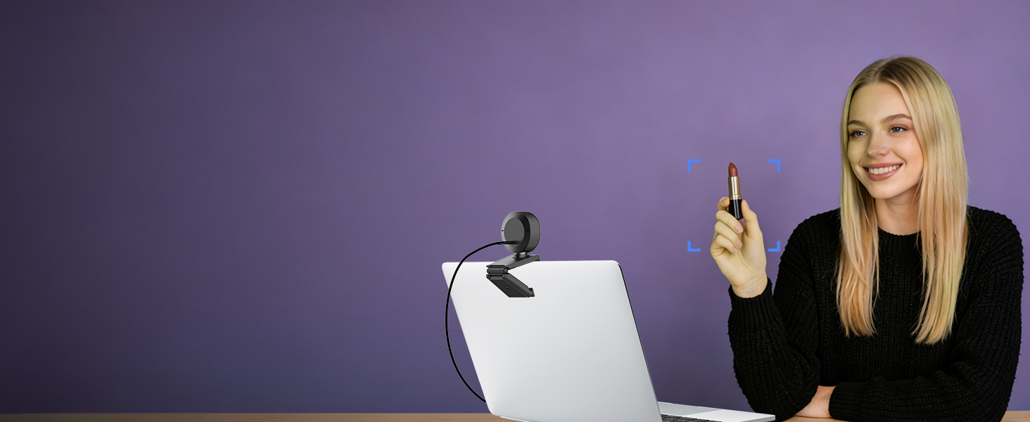 Woman in black jacket gestures toward a white cylindrical device on a stand against purple background, demonstrating product features.