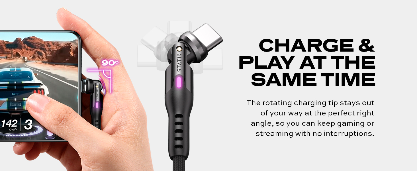 Rotating phone charging cable with angled connector shown charging a phone displaying gaming content, designed for simultaneous play and charging.