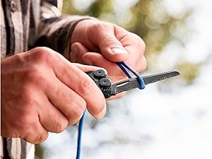 Photo of person cutting rope with a serrated knife on the with the Wave+ multi-tool