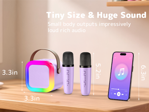 Text reads 'Tiny Size &amp; Huge Sound'. Product display showing small pink cube speaker (3.3in), two purple containers, and smartphone with music app interface against wooden surface.