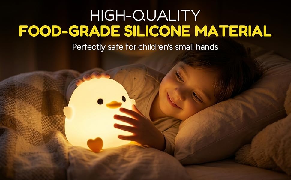 Child holding a soft silicone duck night light in bed.