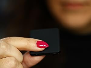 Tilerec mini recorder audio device being held in ahnd