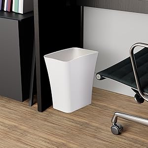 plastic waste bin under office desk