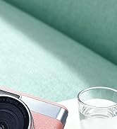 Close-up product shots of clear glass containers or vessels on teal-colored background with reflective surface.