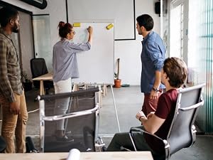 Entrepreneur team brainstorming ideas, planning tasks &amp;amp; projects for business success