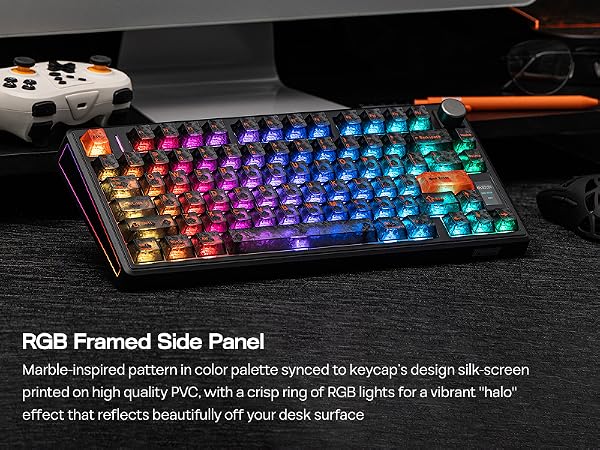 Text reads 'RGB Framed Side Panel'. Gaming keyboard with vibrant RGB backlighting displaying rainbow colors across mechanical keys on dark surface.