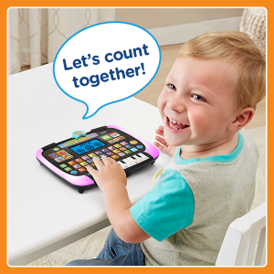 Child playing with tablet at a table. Talk bubble says “Let’s count together!”