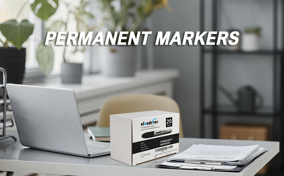 permanent markers on the desk next to laptop, files 