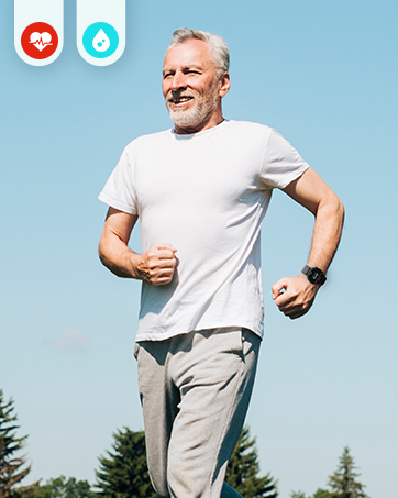 Man in white t-shirt and light pants jogging outdoors. Blue sky background with trees visible. Two icons in upper left corner.