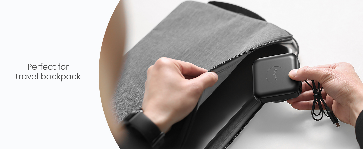Hands placing a small black electronic device into a grey zippered compartment, labeled 'Perfect for travel backpack'. Demonstrates compact storage solution for portable electronics.