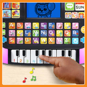 Child’s hand pressing piano button on Little Apps Learning Tablet with music notes.