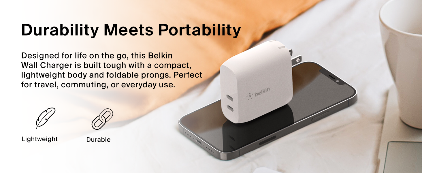 Image of portable wall charger on top of phone with text reading durability meets portability.