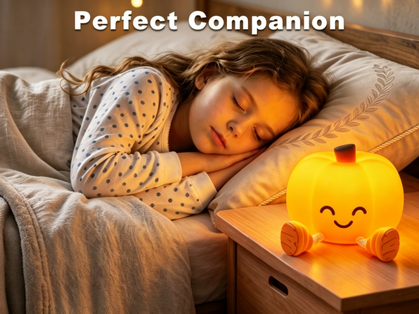 A pumpkin nightlight on the nightstand