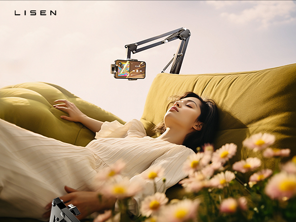 Lisen brand adjustable phone mount with articulating arm hovering over yellow couch, surrounded by daisies in outdoor setting.