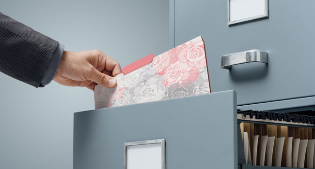 Placing folder in cabinet