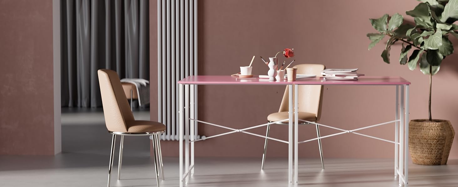 Modern dining set with pink rectangular table and beige chairs. White metal frame supports table. Potted plant and table settings visible. Room has pink walls and gray curtains.