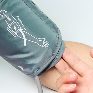 the wrist of a person with a stethoscope on their wrist