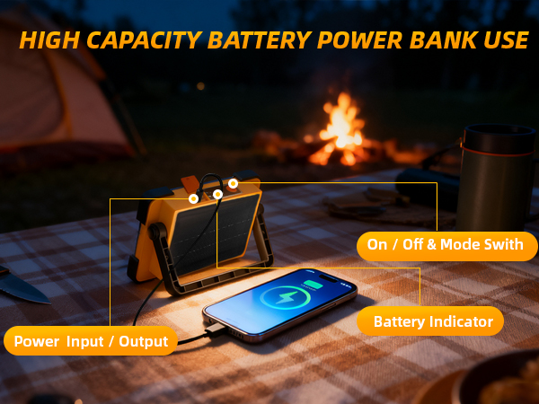 LED work light with USB output charging smartphone at campsite picnic table