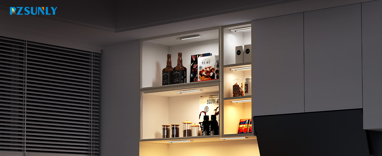 Text reads 'ZALMLY'. Interior shelf display illuminated with ambient lighting, showing bottles and decorative items against dark wall with window blinds.