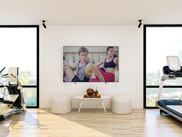 a large television is mounted on a wall in a living room.