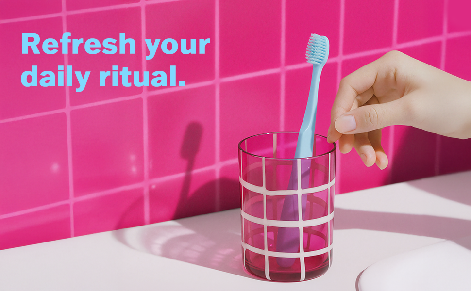 Toothbrush for adults with sensitive gums, extra-soft bristles, wide head, ergonomic non-slip grip.