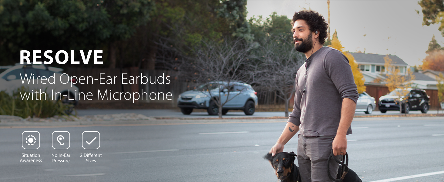 Man wearing Avantree resolve while walking dog.