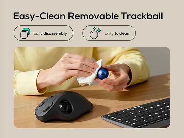 Text reads 'Easy-Clean Removable Trackball'. Demonstration image showing hands cleaning a computer 