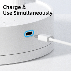 A close-up of a white device&amp;#39;s USB-C port being plugged in for simultaneous charging and use.