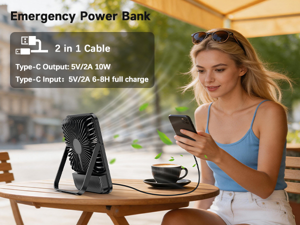 Text reads: 'Emergency Power Bank', '2 in 1 Cable', 'Type-C Output: 9V/2A 10W', 'Type-C Input: 5V/2A 6-8H full charge'. Portable power bank with attached dual cable being used outdoors on table; woman holding smartphone nearby.