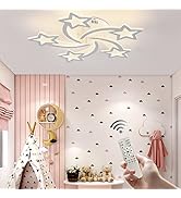 Modern star-shaped LED ceiling light fixture in children's room, shown with remote control and pink-themed decor.