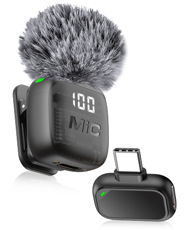 Text reads 'rode' and 'wireless'. Rode Wireless GO microphone system with gray furry windscreen, digital display screen showing 'dB' indicator, and compact black carrying case with handle.