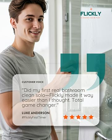 Young white man cleaning a glass shower, sharing a positive bathroom cleaning testimonial.