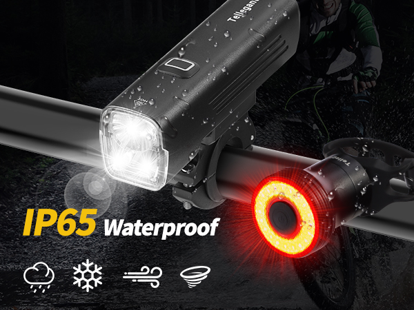 Bicycle light set with front white LED and rear red circular light. Waterproof IP65 rating. Icons show rain, sun, wind, and shock resistance.