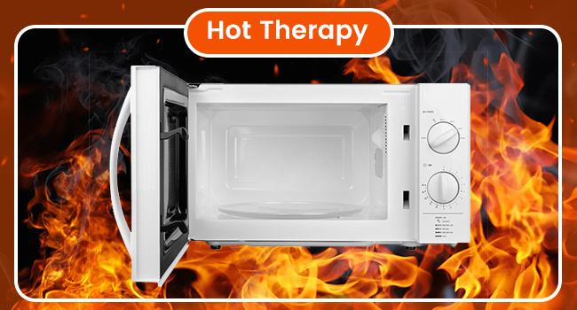 White compact microwave oven with manual control dials shown against dramatic flame background. Title reads 'Hot Therapy' above the appliance.