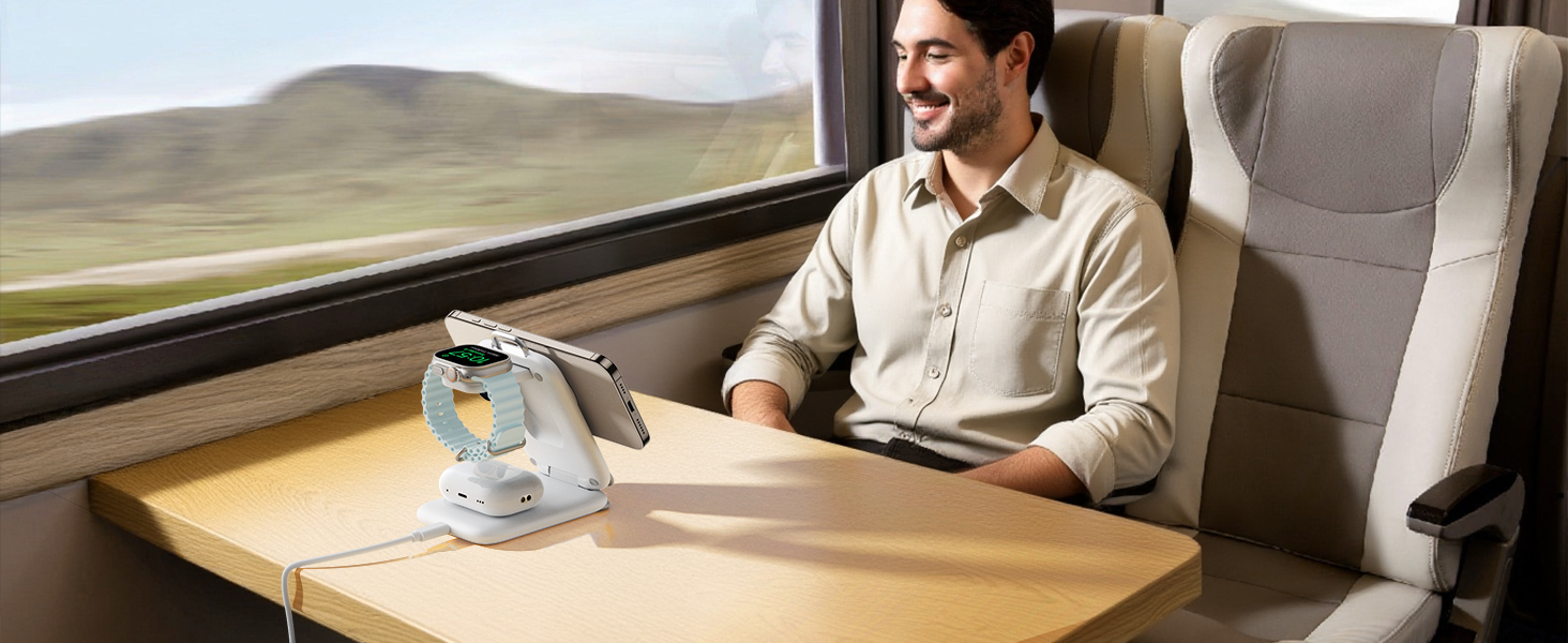 Person seated by train window with table, showing travel scenario with beverage service and scenic view outside.