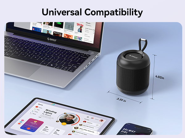 Text reads 'Universal Compatibility'. Black cylindrical device displayed on light blue surface near laptop, tablet, and smartphone with USB cable connector visible.