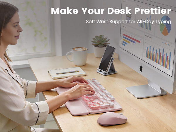 Woman typing on pink wireless keyboard mouse combo with wrist rest on tidy desk
