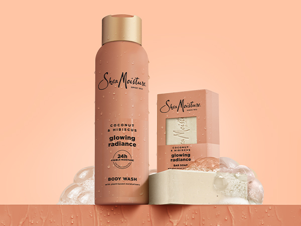 A collection shot of the Coconut &amp; Hibiscus Body Wash and Bar Soap on a coral background.