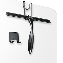 Black matte shower squeegee hanging on the glass