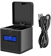 Black camera battery charger with blue LED display, open lid showing three charging slots, and USB cable. Compact cube design with power button on front.