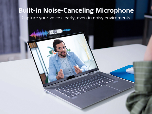 a laptop with a microphone on the screen