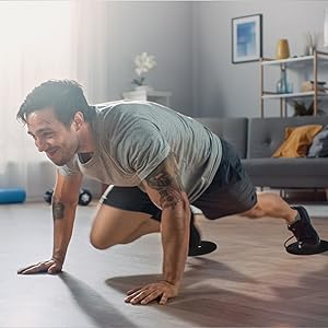 Man doing mountain climbers at home using Limm Core Sliders