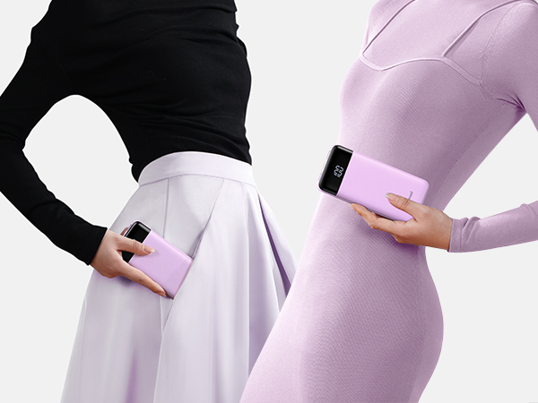 two women holding a cell phone in their hands