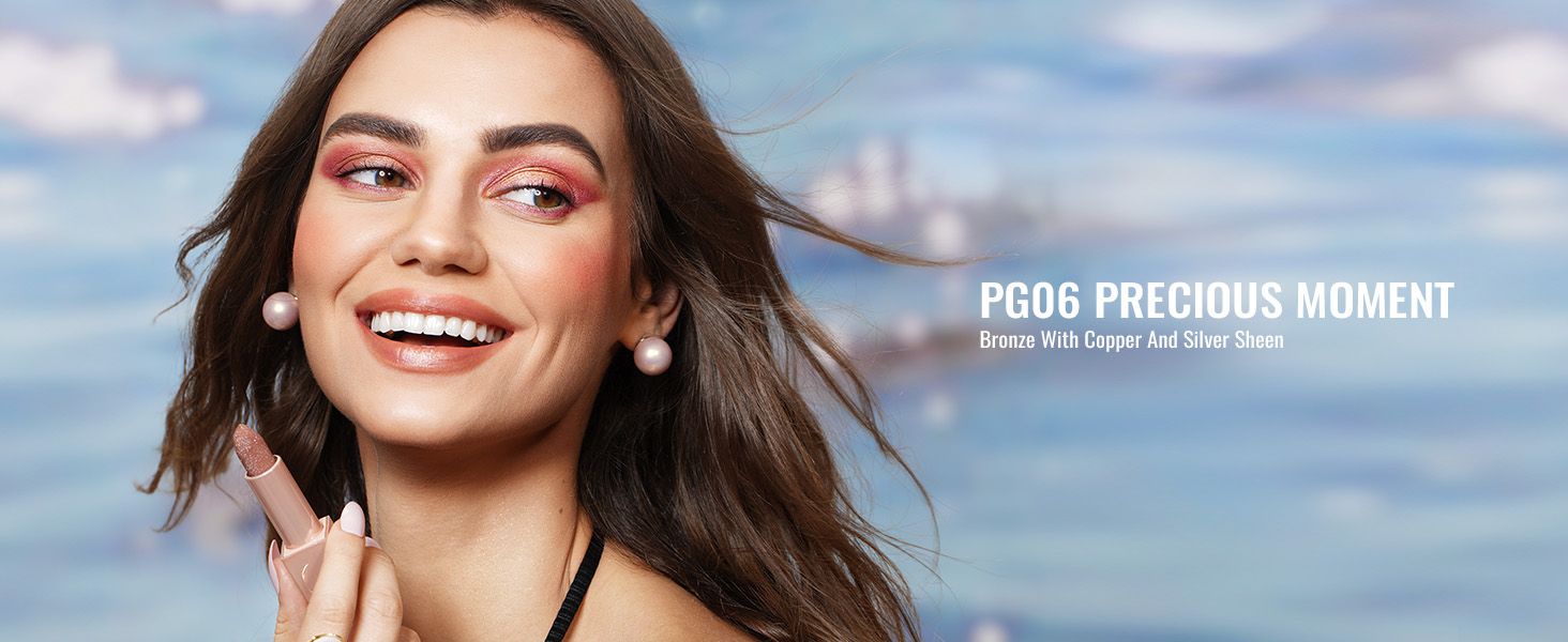 Close-up of a woman with glowing skin and vibrant makeup smiling against a blurred beach backdrop. Text reads 'PRO6 PRECIOUS MOMENT'.