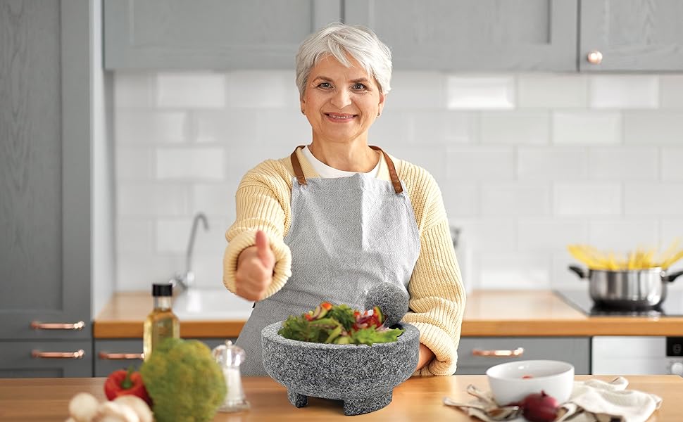 Woman Grinding with Umien Mortar and Pestle