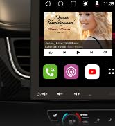 Car dashboard display interface showing navigation or media screen with pink-tinted icons and dark background.