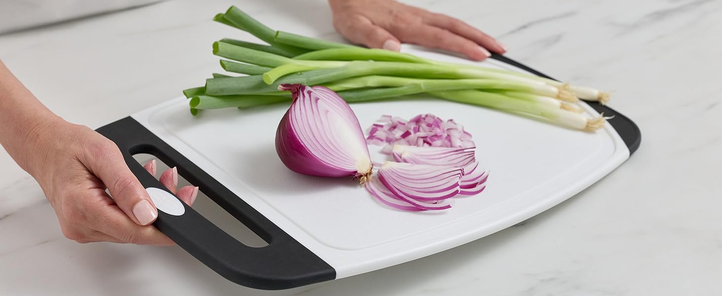 Cutting board with non-slip rubber handles