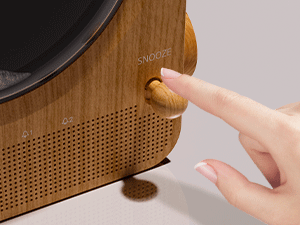 Sequence showing hand interaction with wooden surface featuring perforated pattern, demonstrating some kind of adjustment or installation process.