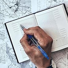 Pen shows person travel-journaling with the G2 Fine pen