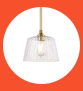 The Aggie is a brushed nickel indoor pendant light with clear ribbed glass.